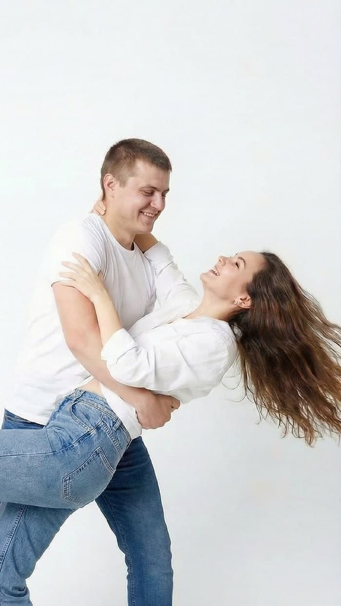 Studio couple photoshoot in white.