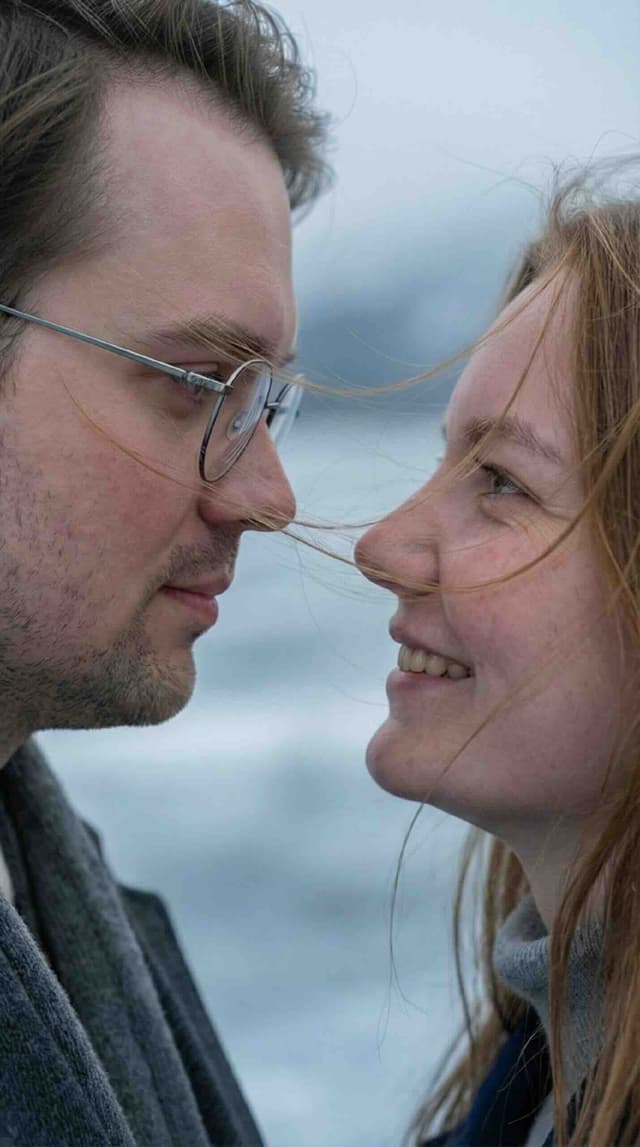 Christmas photo AI: stylish couple in coats on frozen lake, wind